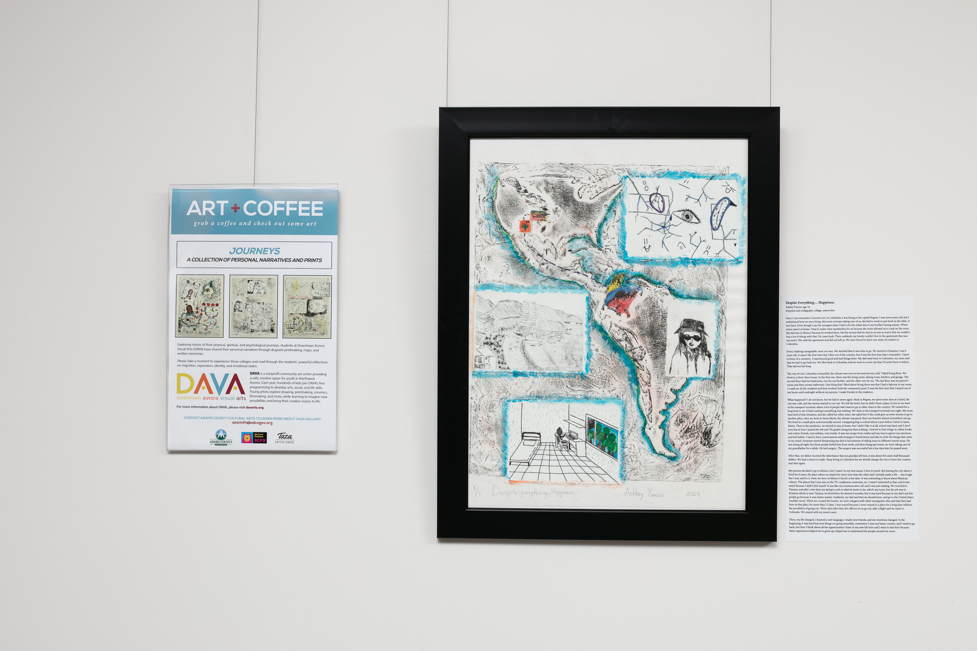 Art gallery wall with a framed map-themed artwork by Ashley Yacus, accompanied by an informational poster titled "ART+COFFEE" detailing the "Journeys" exhibit.