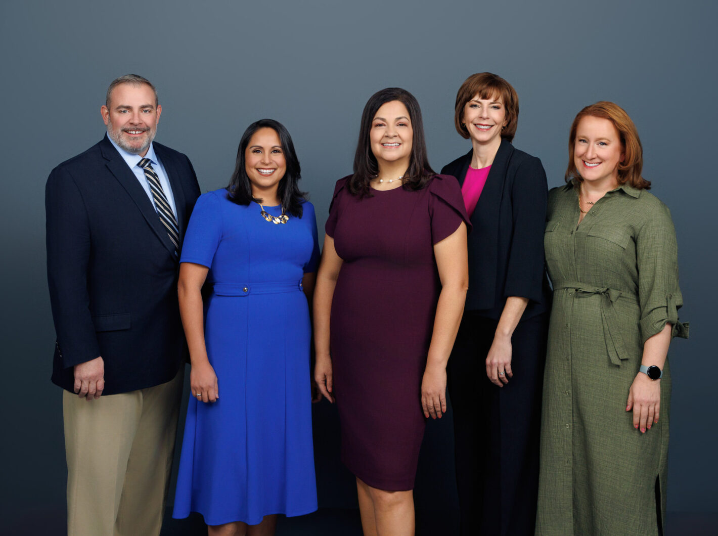 Adams County group portrait, five people smiling, formal attire, blue and maroon outfits.