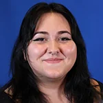 Haley smiling against a blue background