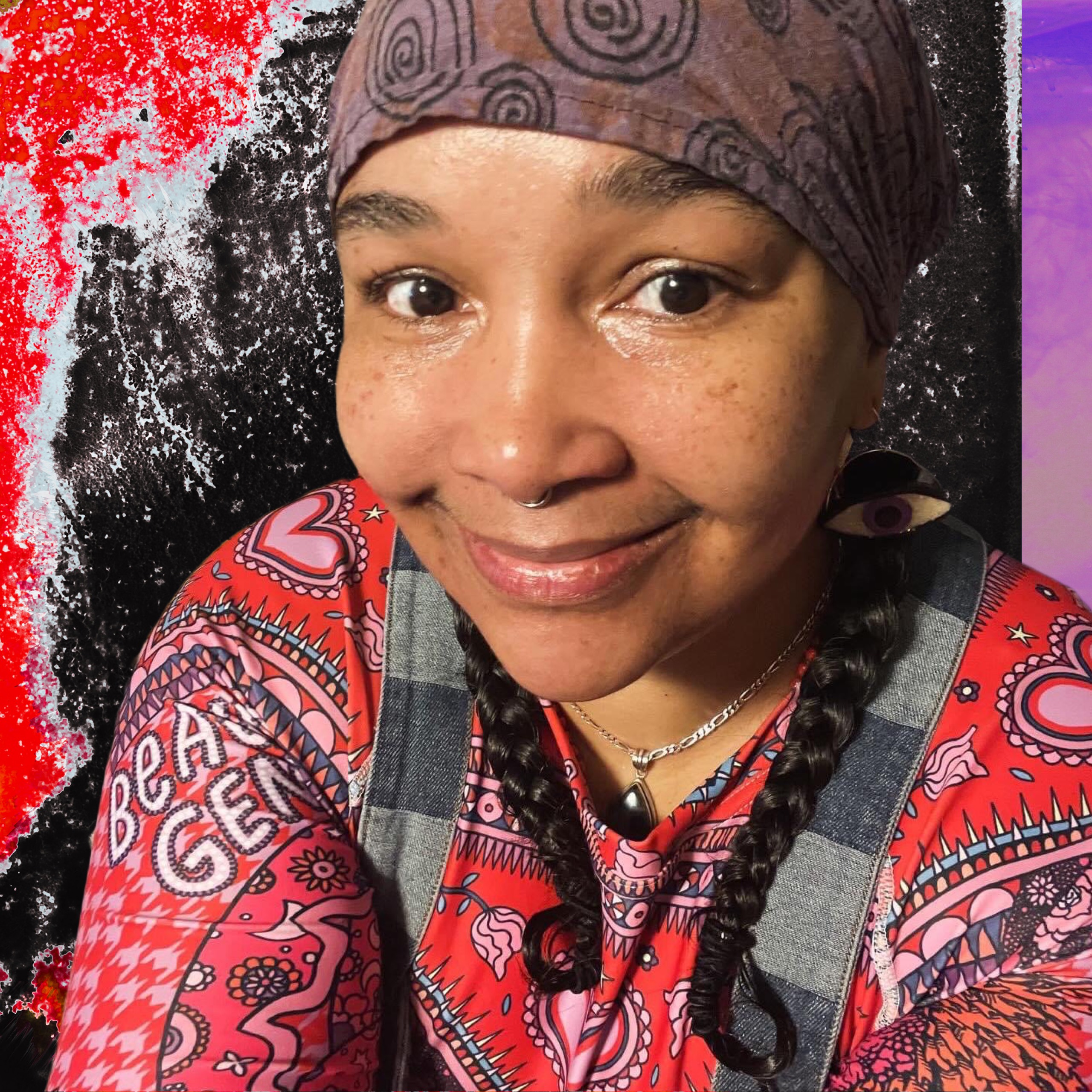 Meca Ayo smiling, wearing a patterned headscarf and vibrant red top, intricate background.