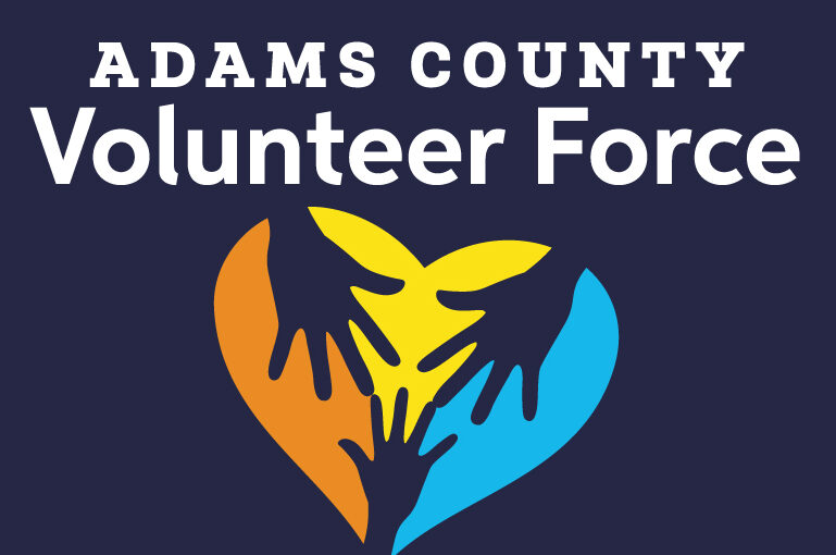 Adams County Volunteer Force logo with colorful hands forming a heart.