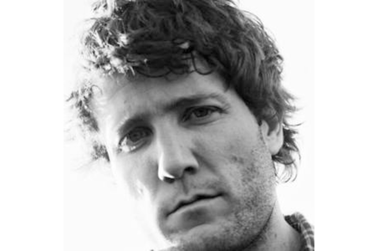 Viking with thoughtful expression and tousled hair, black-and-white portrait