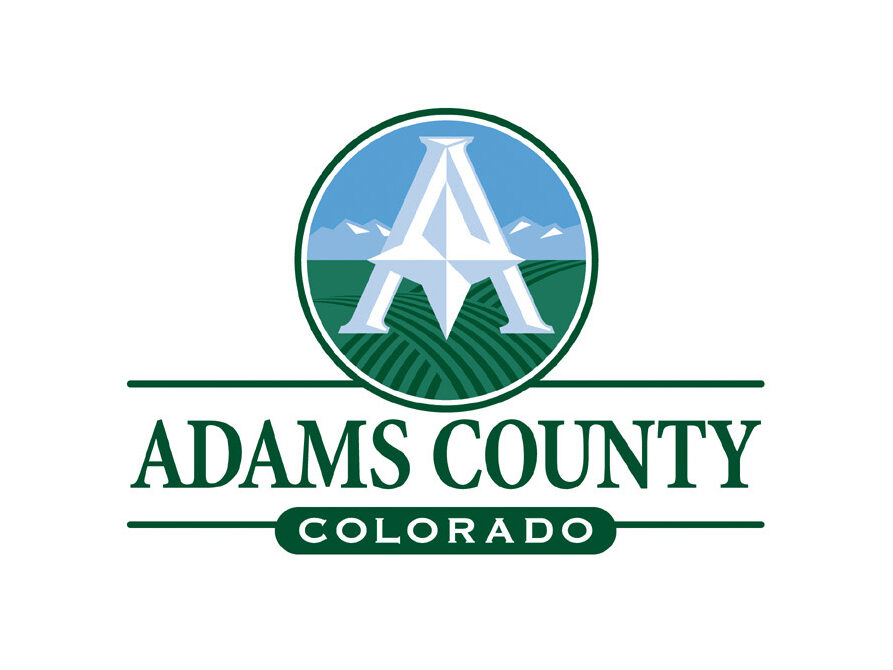 Adams County Colorado logo featuring a large "A" over farmland and mountains in a blue circle
