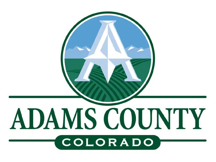 Adams County logo with large "A" over fields and mountains, text reads "ADAMS COUNTY COLORADO"