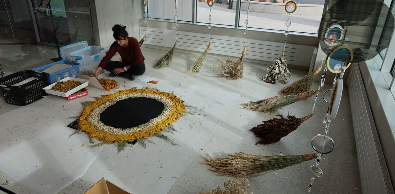 Artist working on craft.