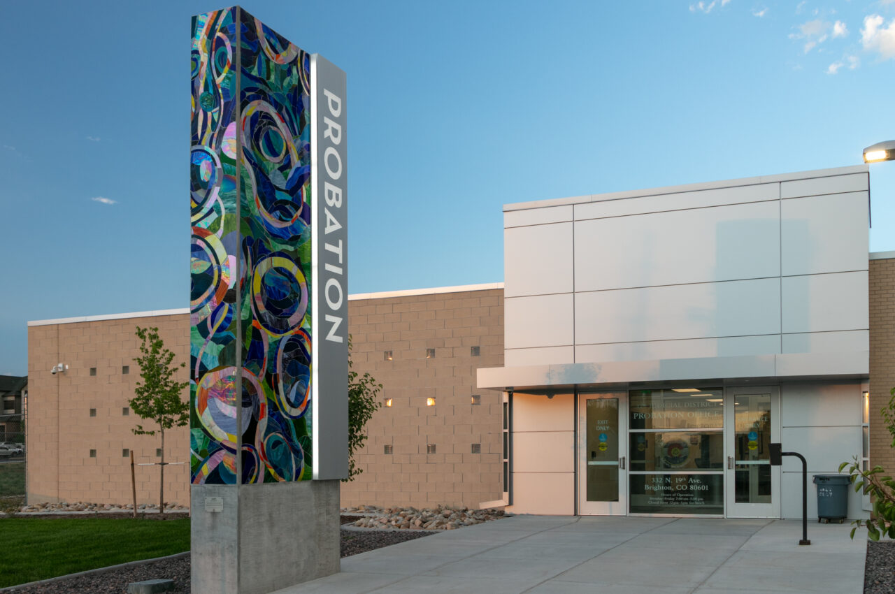 Probation office entrance with colorful abstract tower displaying "PROBATION" text