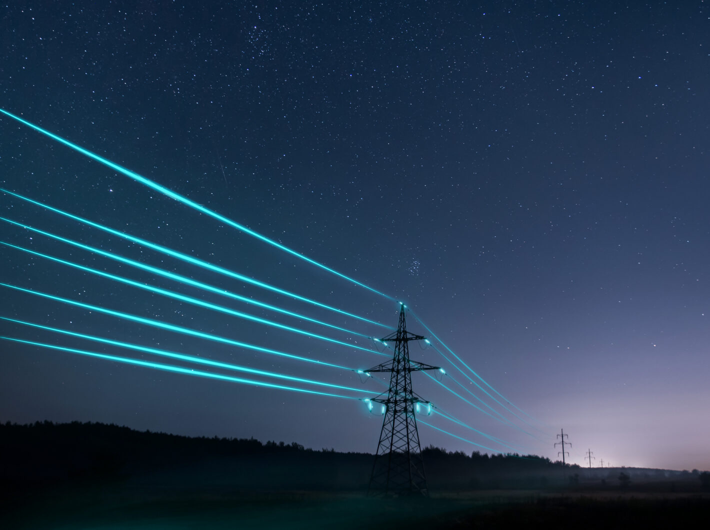 Electricity pylon at night with glowing lines illustrating power flow