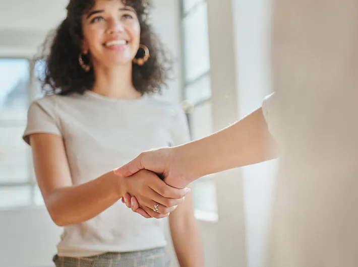 Two people shaking hands.